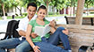 A couple studying by the bench
