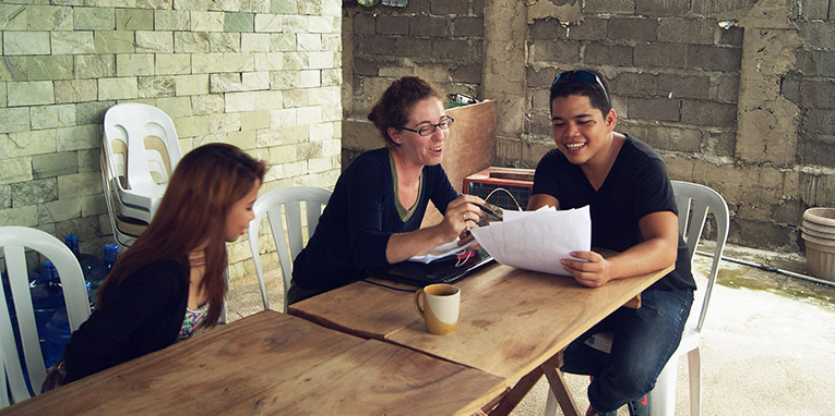 A volunteer talking with locals